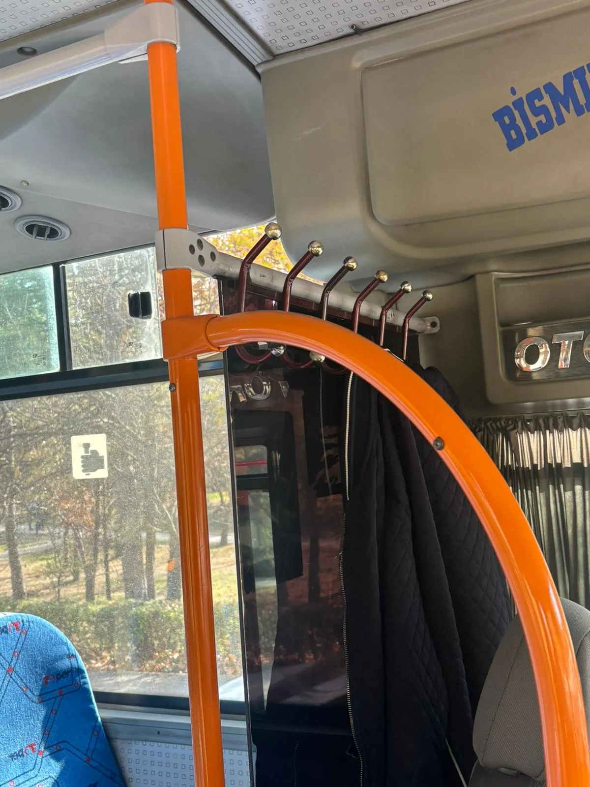Improvised coat hooks behind the driver